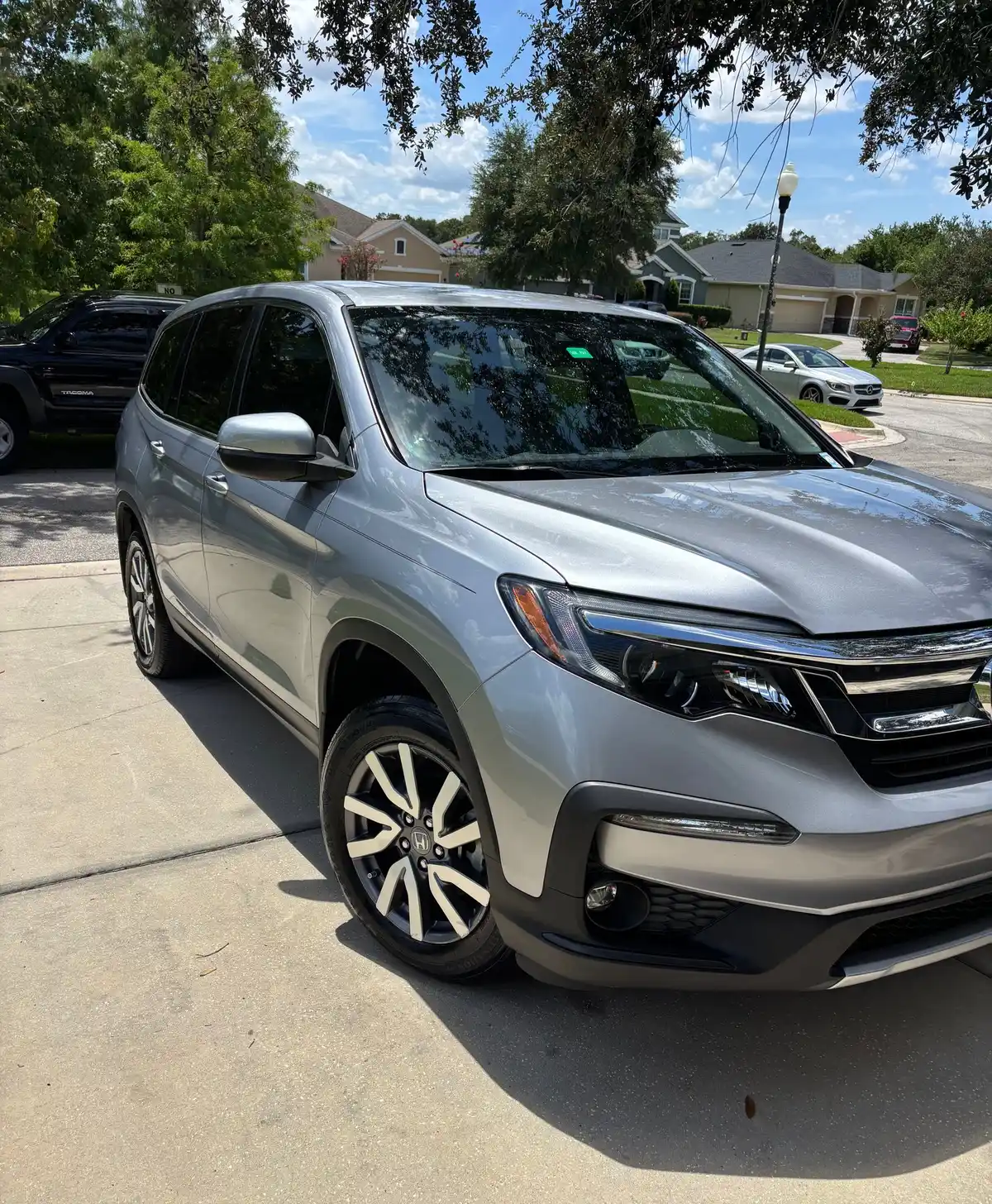 Silver Honda Pilot with a clean, glossy finish after detailing