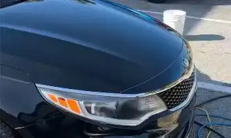 The same Kia headlight after restoration, with a clear lens