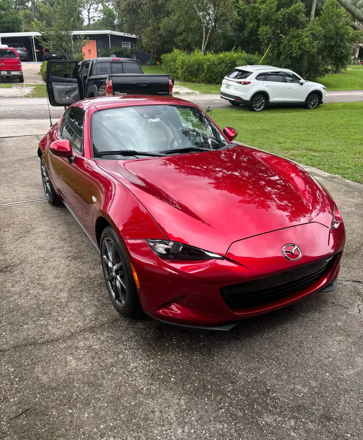 Red Mazda MX-5 Miata RF with glossy, reflective paint after detailing