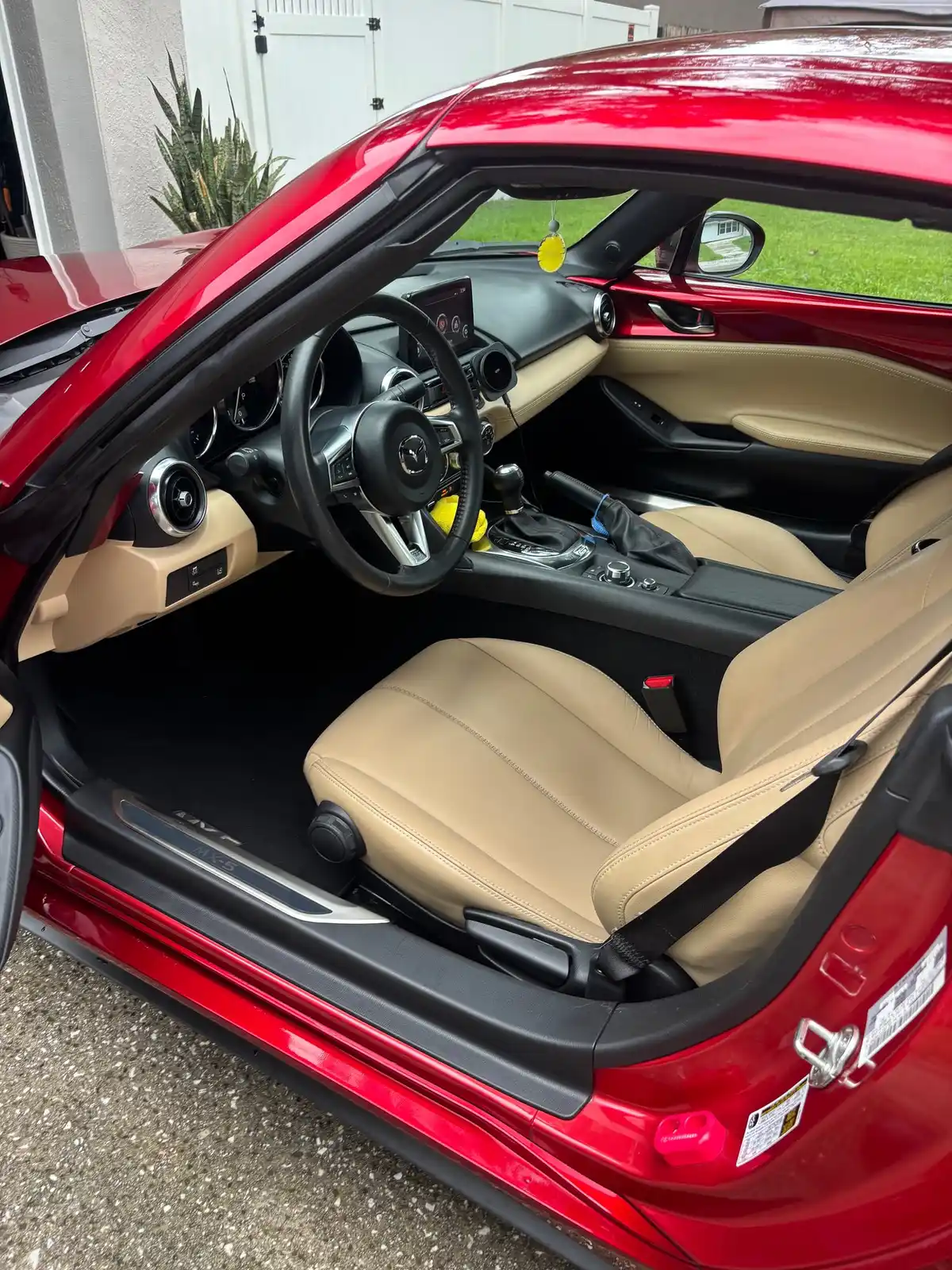 Mazda Miata tan leather interior after an interior detail