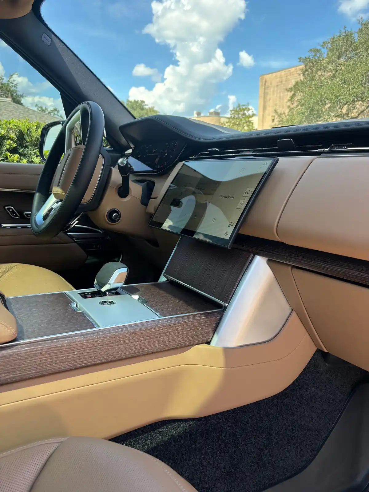 Range Rover dashboard and center console in caramel leather after an interior detail
